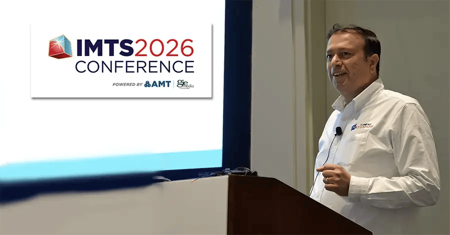 Ram Eswaran, Kubotek Kosmos CTO &amp; COO, standing at a podium with a lavelier microphone addressing conference attendees